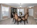 Elegant dining room featuring a round table, comfortable seating, and stylish decor at 2574 Hidden Cove Ln, Clearwater, FL 33763