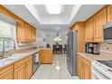 Bright kitchen features stainless steel appliances, light wood cabinetry, and an eat-in dining area at 28628 Twinbrook # Ln, Wesley Chapel, FL 33543