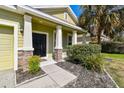 Inviting front porch with decorative stone accents and lush landscaping at 3015 Azalea Blossom Dr, Plant City, FL 33567