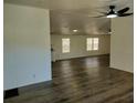 Open-concept living area showcases updated flooring and a bright, airy atmosphere at 4102 Fox Ridge Blvd, Wesley Chapel, FL 33543