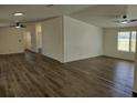 Spacious living room featuring new floors, ceiling fans, and natural light at 4102 Fox Ridge Blvd, Wesley Chapel, FL 33543