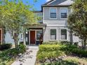 Charming two-story home with inviting walkway, lovely front yard, and vibrant landscaping at 5714 Colony Glen Rd, Lithia, FL 33547