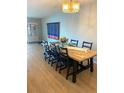 Inviting dining room featuring a large table, stylish seating, and ample natural light at 5955 30Th S Ave # 108, Gulfport, FL 33707