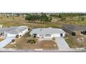 Charming home with an attached garage, well-manicured bushes, and located near a beautiful green space at 646 Allegheny Dr, Sun City Center, FL 33573