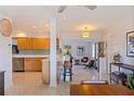An open floorplan integrates the kitchen, living, and dining areas, creating a spacious and modern home at 725 85Th N Ave, St Petersburg, FL 33702
