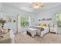 Light and airy bedroom with a large window, plush carpet, and a comfortable bed creating a peaceful retreat at 9019 Stone Dr, Webster, FL 33597