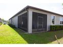 Spacious screened patio with black aluminum frame, great for outdoor living at 9943 Campanula Ct, Land O Lakes, FL 34637