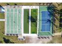 An aerial view showcasing the shuffleboard courts and tennis courts at 10029 Wellington Ave, Dade City, FL 33525