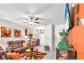Bright and cozy living room with a comfortable sofa, stylish decorations, and an entertainment center at 12913 Dream Catcher Way, Riverview, FL 33579