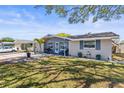 Well-maintained home with a manicured lawn, and fresh exterior paint at 1344 Dartmouth Dr, Holiday, FL 34691