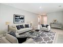 Bright living room featuring modern furniture, neutral colors, and stylish decor, creating a welcoming atmosphere at 14020 Sooty Tern Ave, Brooksville, FL 34614