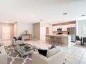 Open-concept design combining the living area, kitchen, and dining space for modern living at 14020 Sooty Tern Ave, Brooksville, FL 34614