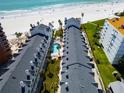 Aerial view of condo complex featuring swimming pool and easy beach access at 17960 Gulf Blvd # 111, Redington Shores, FL 33708