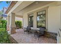 Inviting front porch with comfortable seating, perfect for enjoying the outdoors and neighborhood views at 4194 Bexley Village Dr, Land O Lakes, FL 34638