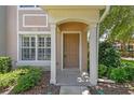 Inviting front entrance with covered porch and neatly landscaped surroundings at 4516 Barnstead Dr, Riverview, FL 33578