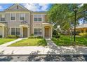 Attractive townhome showcasing a well-kept lawn and inviting front door at 4516 Barnstead Dr, Riverview, FL 33578