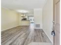 Open living space with modern flooring, seamlessly connecting to the kitchen at 4516 Barnstead Dr, Riverview, FL 33578
