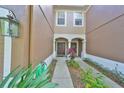 Close-up of a quaint townhome entrance with a welcoming front door and charming curb appeal at 4916 Chatham Gate Dr, Riverview, FL 33578