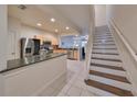 Well-lit kitchen featuring stainless steel appliances, wood cabinets, and sleek countertops at 4916 Chatham Gate Dr, Riverview, FL 33578