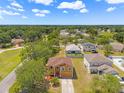 Aerial view of a home, showcasing the surrounding neighborhood and lush greenery at 7102 W Creek Dr, Tampa, FL 33615