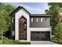 Stunning modern farmhouse featuring black siding, stucco accents, large windows, and a two-car garage at 812 W Braddock St, Tampa, FL 33603
