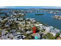 An aerial view shows the property's waterfront neighborhood and its proximity to the open bay at 1214 Bay Shore Blvd, Indian Rocks Beach, FL 33785