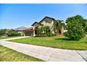 Well-maintained home with lush landscaping and a neatly manicured lawn at 1704 Via Palermo St, Plant City, FL 33566