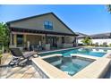 Beautiful backyard showcasing a private pool, spa, pergola, and landscaped grounds at 1704 Via Palermo St, Plant City, FL 33566