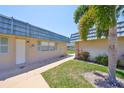 Exterior view with neatly maintained lawns and walkways; community exudes a welcoming and comfortable atmosphere at 1802 Bedford Ter # 187, Sun City Center, FL 33573