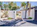 Inviting entryway with well-maintained landscaping and white stucco walls at 1881 N Hercules Ave # 1303, Clearwater, FL 33765