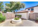 Well-maintained home exterior with mature trees and landscaping, featuring a cozy courtyard at 1881 N Hercules Ave # 1303, Clearwater, FL 33765