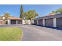 Row of detached garages with mature landscaping and ample parking space at 1881 N Hercules Ave # 1303, Clearwater, FL 33765