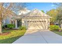 Spacious two-car garage featuring an extended driveway, offering convenience and ample parking at 20121 Bending Creek Pl, Tampa, FL 33647