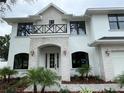 A beautiful exterior featuring brick, black framed windows and a balcony at 3910 W San Carlos St, Tampa, FL 33629