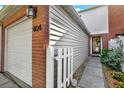 Exterior view of townhome showing brick, siding, and gated entrance to the property at 404 Danube Ave, Tampa, FL 33606
