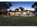 The home offers a well-manicured lawn and inviting exterior, with fresh paint at 420 48Th N St, St Petersburg, FL 33713