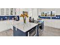 Beautiful kitchen showcasing white cabinets, quartz countertops, and updated appliances at 420 48Th N St, St Petersburg, FL 33713