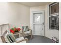 Relaxing balcony with chairs, pillows, and flowers creating an inviting outdoor space at 5155 Isla Key S Blvd # 304, St Petersburg, FL 33715
