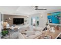 Bright and airy living room featuring modern décor, large windows, and comfortable seating at 5240 Coquina Key Se Dr # B, St Petersburg, FL 33705