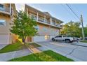Spacious townhome featuring a multi-car garage and large covered porch at 6822 Kissimmee St # 8-B, Tampa, FL 33616