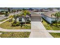 Well-maintained single-story home with beautiful landscaping and long driveway at 7202 Ozello Trail Ave, Ruskin, FL 33573