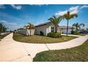 Inviting single-story home featuring lush landscaping and a two car garage at 7202 Ozello Trail Ave, Ruskin, FL 33573