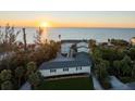 Beach house boasts scenic ocean views, mature landscaping, and a tranquil coastal setting at 8030 Manasota Key Rd, Englewood, FL 34223