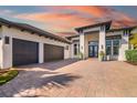 Beautiful home featuring three-car garage with spacious driveway at 11506 Harbourside Ln, Parrish, FL 34219