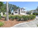 Well-maintained two story home with lush landscaping, featuring a large driveway and attached garage at 16169 Gardendale Dr, Tampa, FL 33624