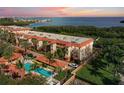 This attractive condo offers lush landscaping, a sparkling pool and a red tiled roof at 1695 Pinellas Bayway S # E6, St Petersburg, FL 33715