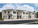 Charming townhomes with a neutral exterior color scheme and individual garages at 3514 Marigold Patch Ct, Plant City, FL 33565