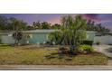 Charming single-story home with a well-manicured front yard and beautiful landscaping at 736 85Th N Ave, St Petersburg, FL 33702