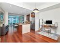 Open-concept living space with modern kitchen, desk area, and floor-to-ceiling windows at 912 Channelside Dr # 2710, Tampa, FL 33602