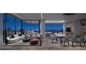 Contemporary living area with floor to ceiling windows showcasing expansive city views at 1101 E Jackson St # 1921, Tampa, FL 33602